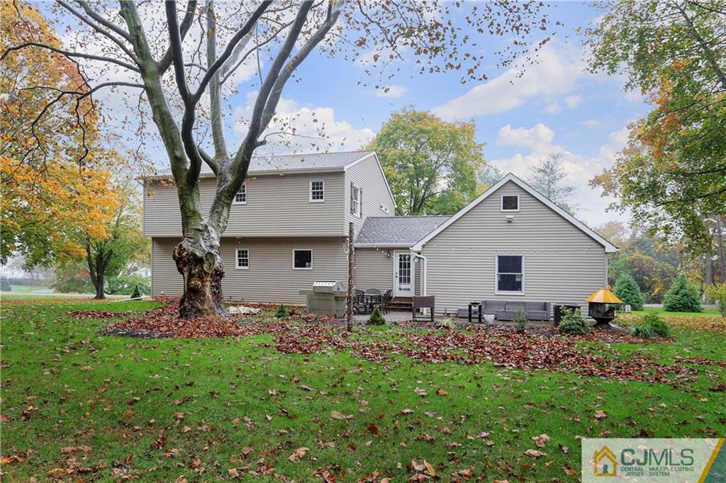 556 Ridge Road Monmouth Junction, NJ 08852 - Photo 17 of 19 a backyard of a house with table and chairs