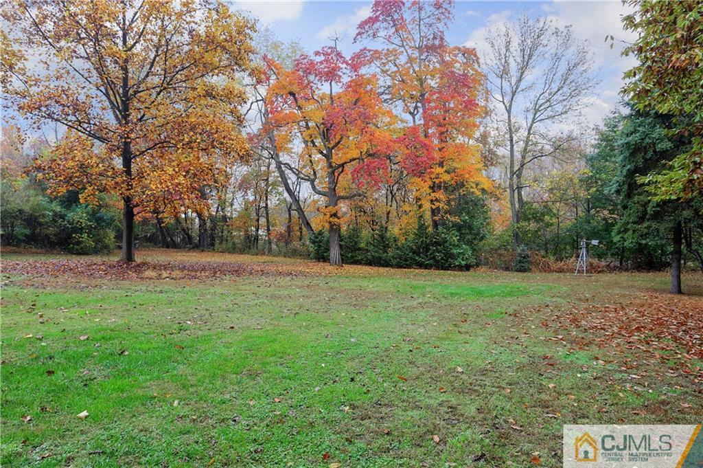 556 Ridge Road Monmouth Junction, NJ 08852 - Photo 19 of 19 a view of outdoor space with deck and yard