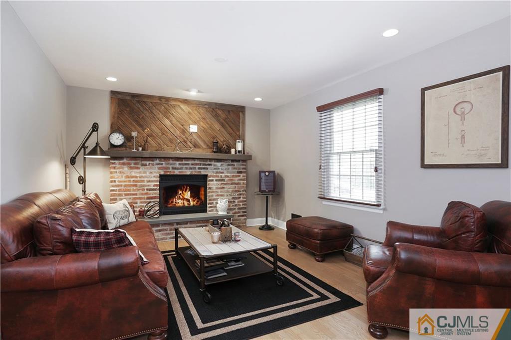 556 Ridge Road Monmouth Junction, NJ 08852 - Photo 6 of 19 a living room with furniture and a fireplace