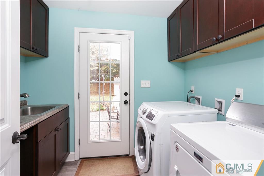 556 Ridge Road Monmouth Junction, NJ 08852 - Photo 7 of 19 a utility room with dryer and washer