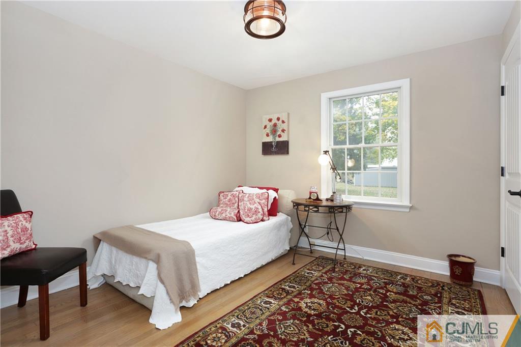 556 Ridge Road Monmouth Junction, NJ 08852 - Photo 9 of 19 a bedroom with a bed and a window