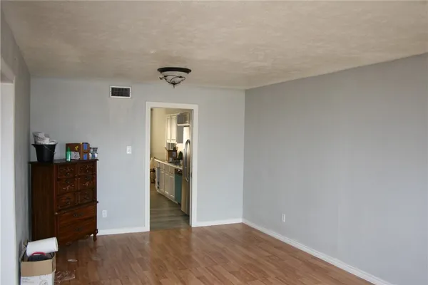 a view of a livingroom with wooden floor