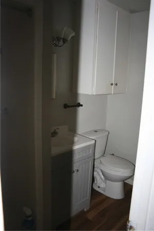 a bathroom with a toilet and a sink