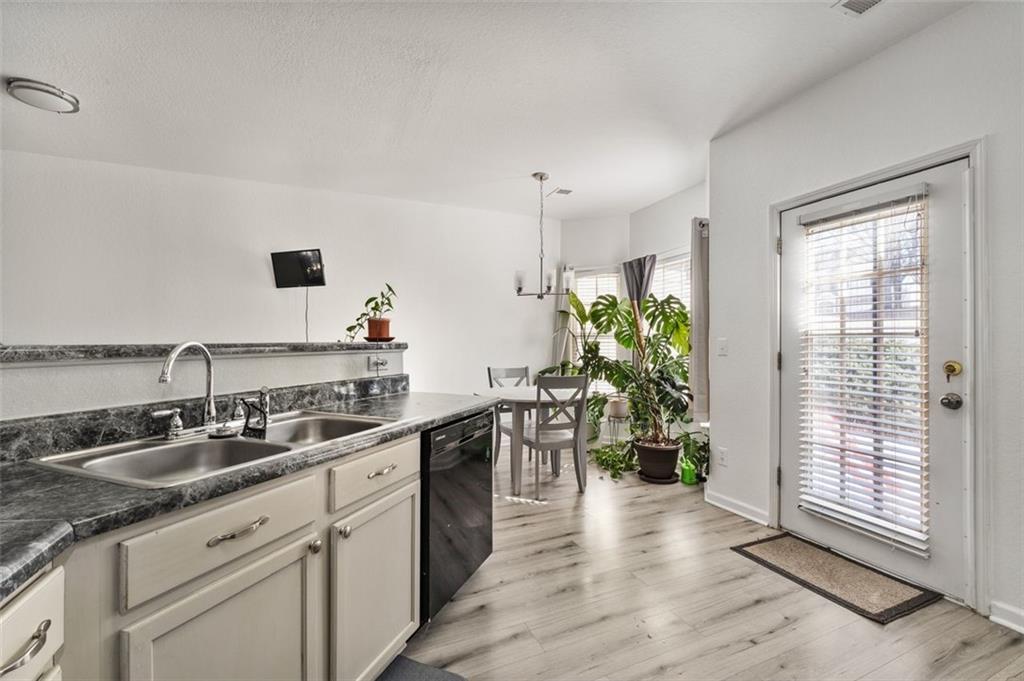 2744 Snapfinger Manor Decatur, GA 30035 - Photo 15 of 29 a kitchen with a sink stove and cabinets