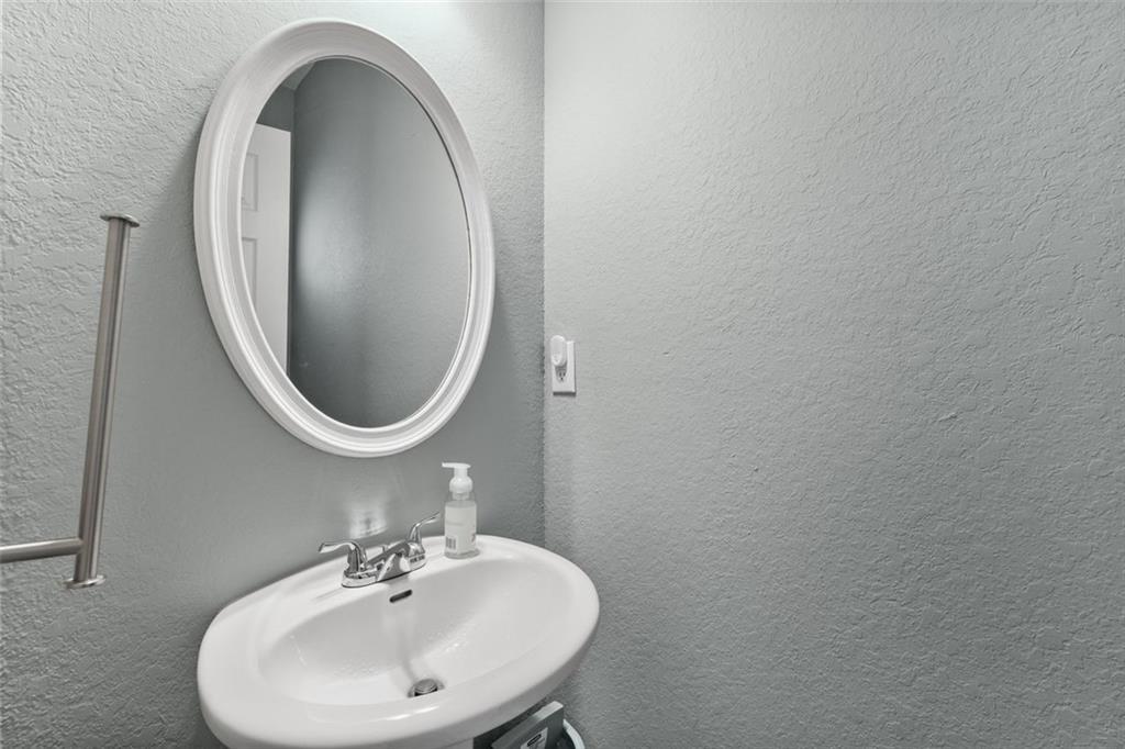 2744 Snapfinger Manor Decatur, GA 30035 - Photo 16 of 29 a bathroom with a sink and a mirror