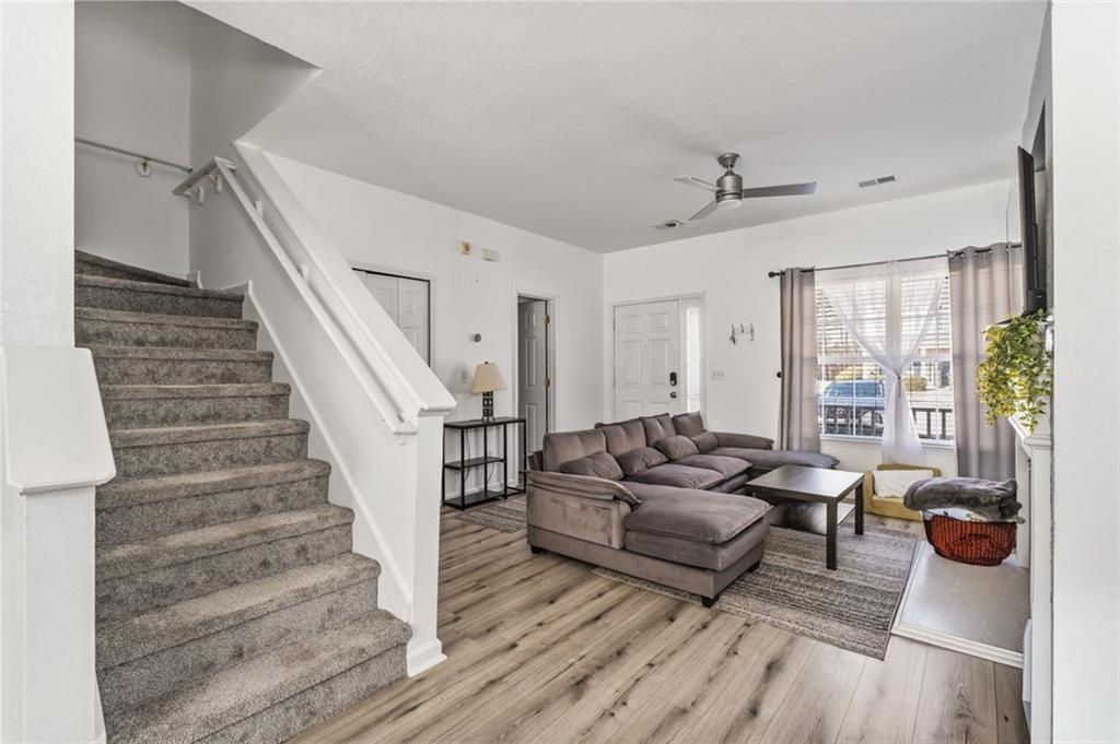 2744 Snapfinger Manor Decatur, GA 30035 - Photo 17 of 29 a living room with furniture and a fireplace