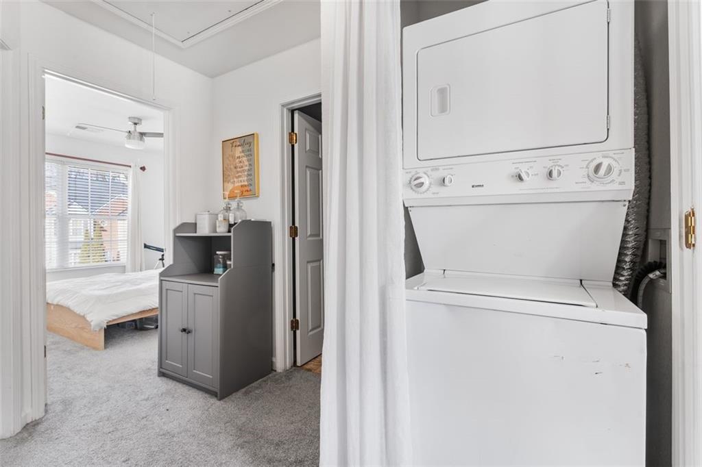 2744 Snapfinger Manor Decatur, GA 30035 - Photo 18 of 29 a view of washer and dryer with bathroom in the background