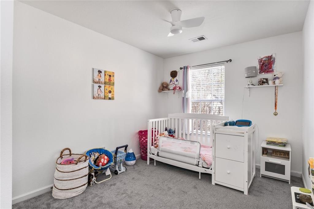 2744 Snapfinger Manor Decatur, GA 30035 - Photo 19 of 29 a bedroom with furniture and a window