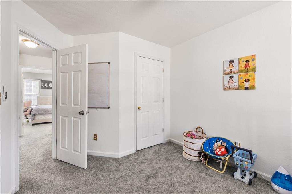 2744 Snapfinger Manor Decatur, GA 30035 - Photo 20 of 29 a view of room with toys and wooden floor