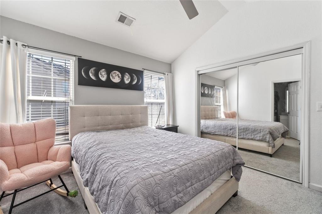 2744 Snapfinger Manor Decatur, GA 30035 - Photo 24 of 29 a bedroom with a bed mirror and window
