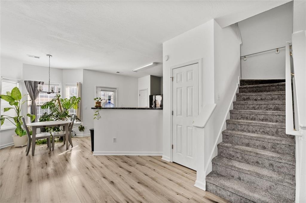 2744 Snapfinger Manor Decatur, GA 30035 - Photo 10 of 29 a view of a dining room with furniture and wooden floor