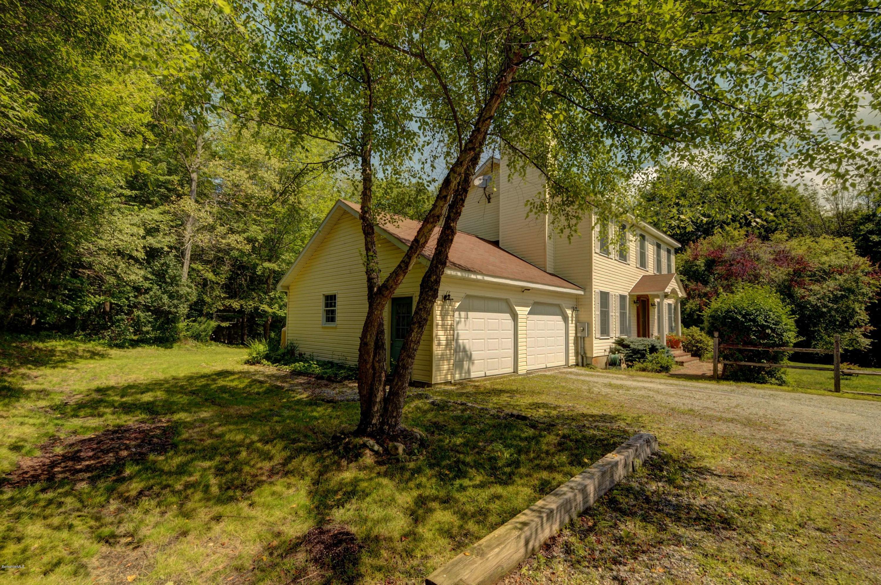 265 Smith Road Hinsdale, MA 01235 - Photo 2 of 27 a tree in front of a white house