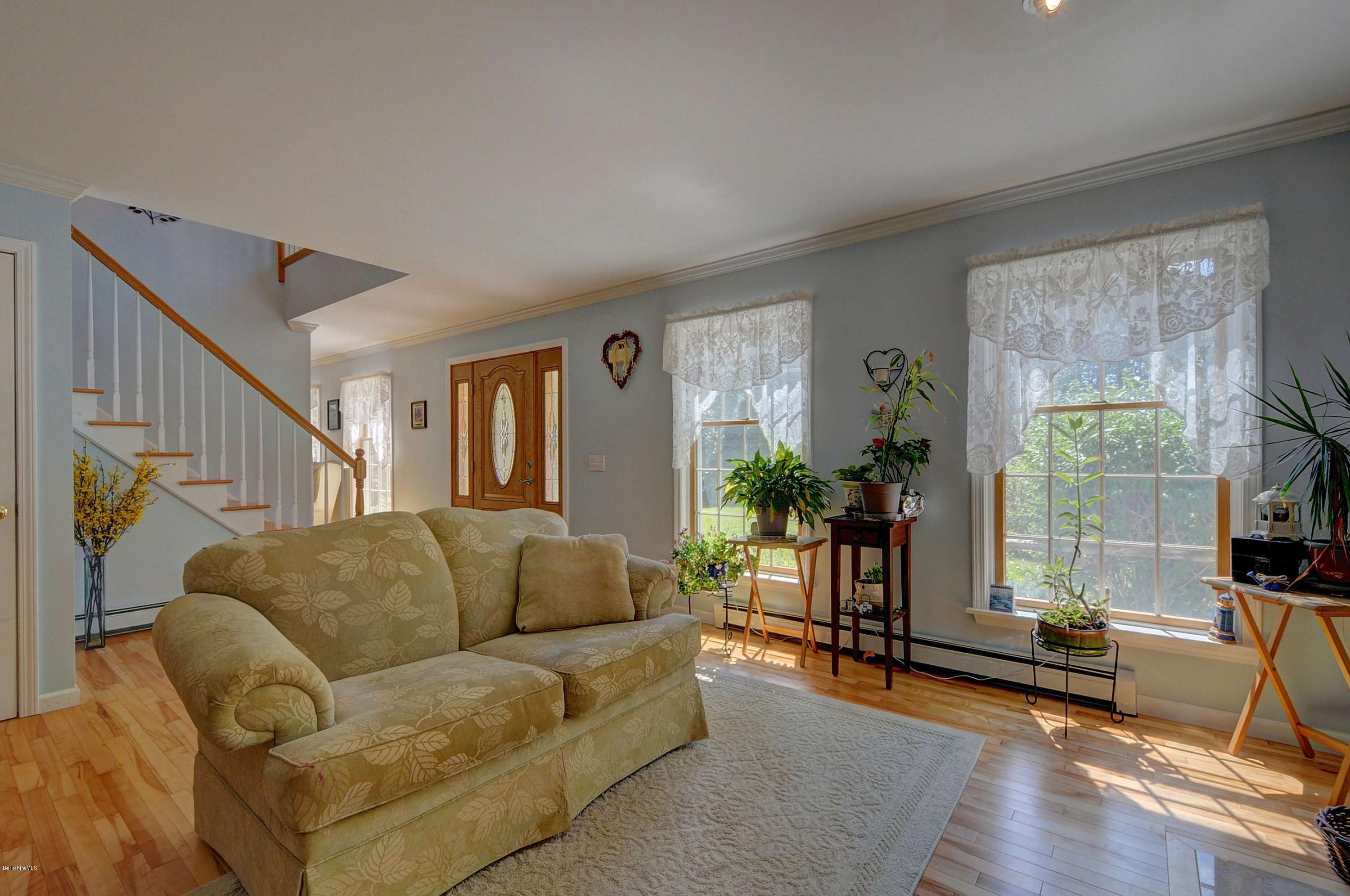 265 Smith Road Hinsdale, MA 01235 - Photo 11 of 27 a living room with furniture and a flat screen tv