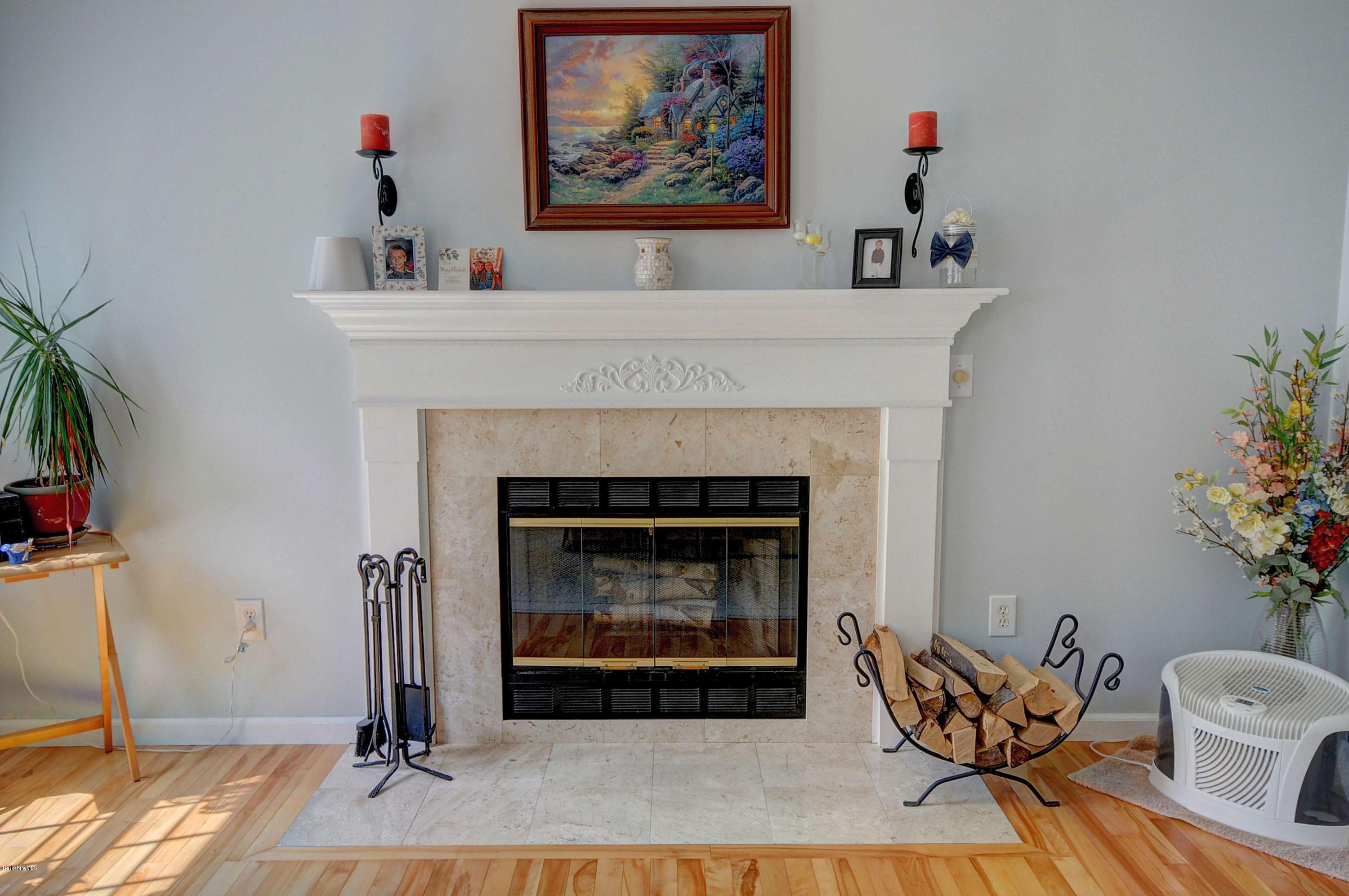 265 Smith Road Hinsdale, MA 01235 - Photo 13 of 27 a living room with furniture and a fireplace