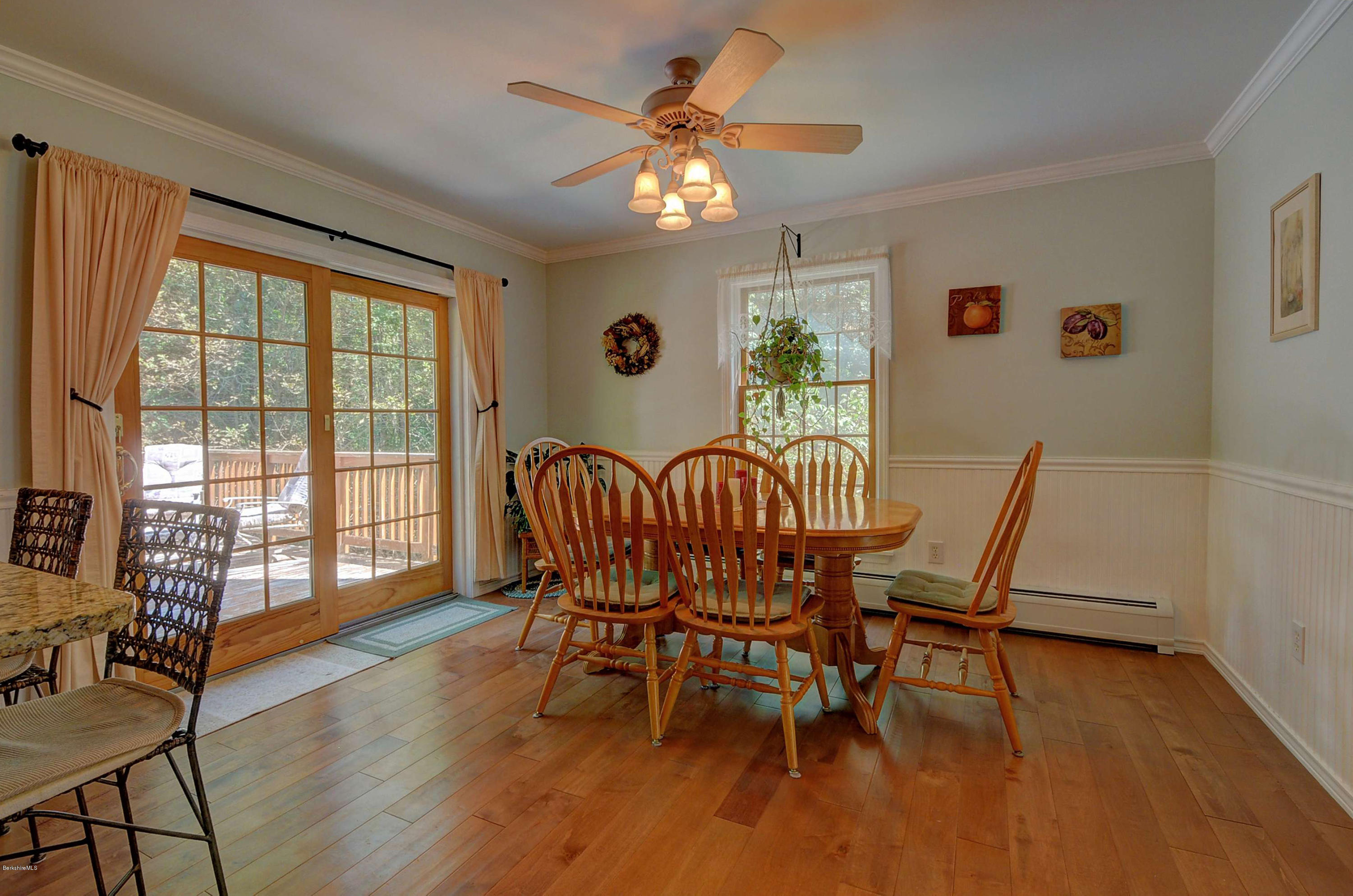 265 Smith Road Hinsdale, MA 01235 - Photo 14 of 27 a dining room with furniture a chandelier and wooden floor