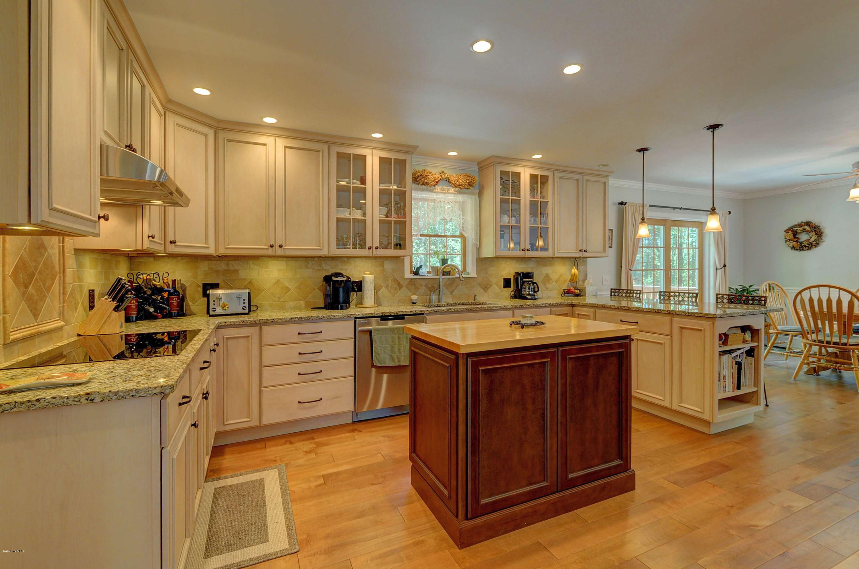 265 Smith Road Hinsdale, MA 01235 - Photo 16 of 27 a kitchen with kitchen island granite countertop a sink counter top space and appliances