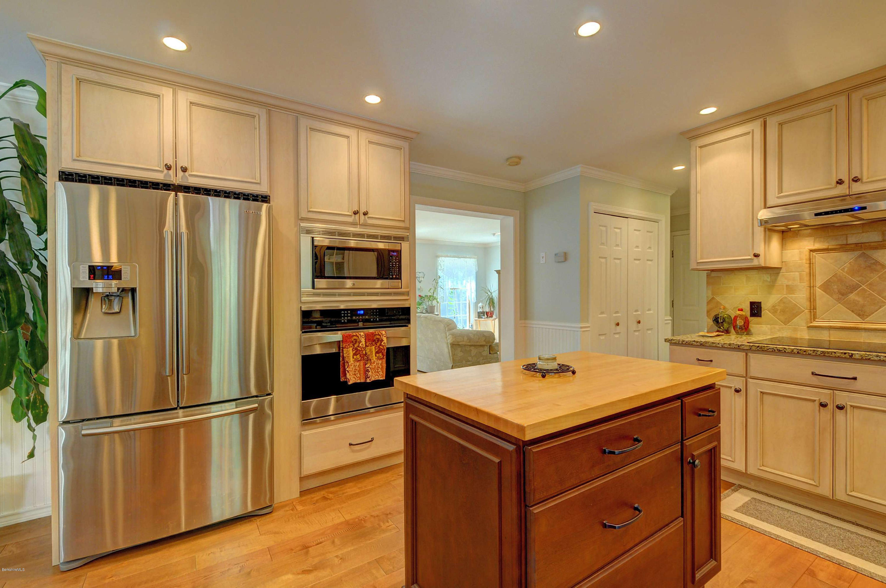 265 Smith Road Hinsdale, MA 01235 - Photo 18 of 27 a kitchen with a refrigerator a sink cabinets and wooden floor
