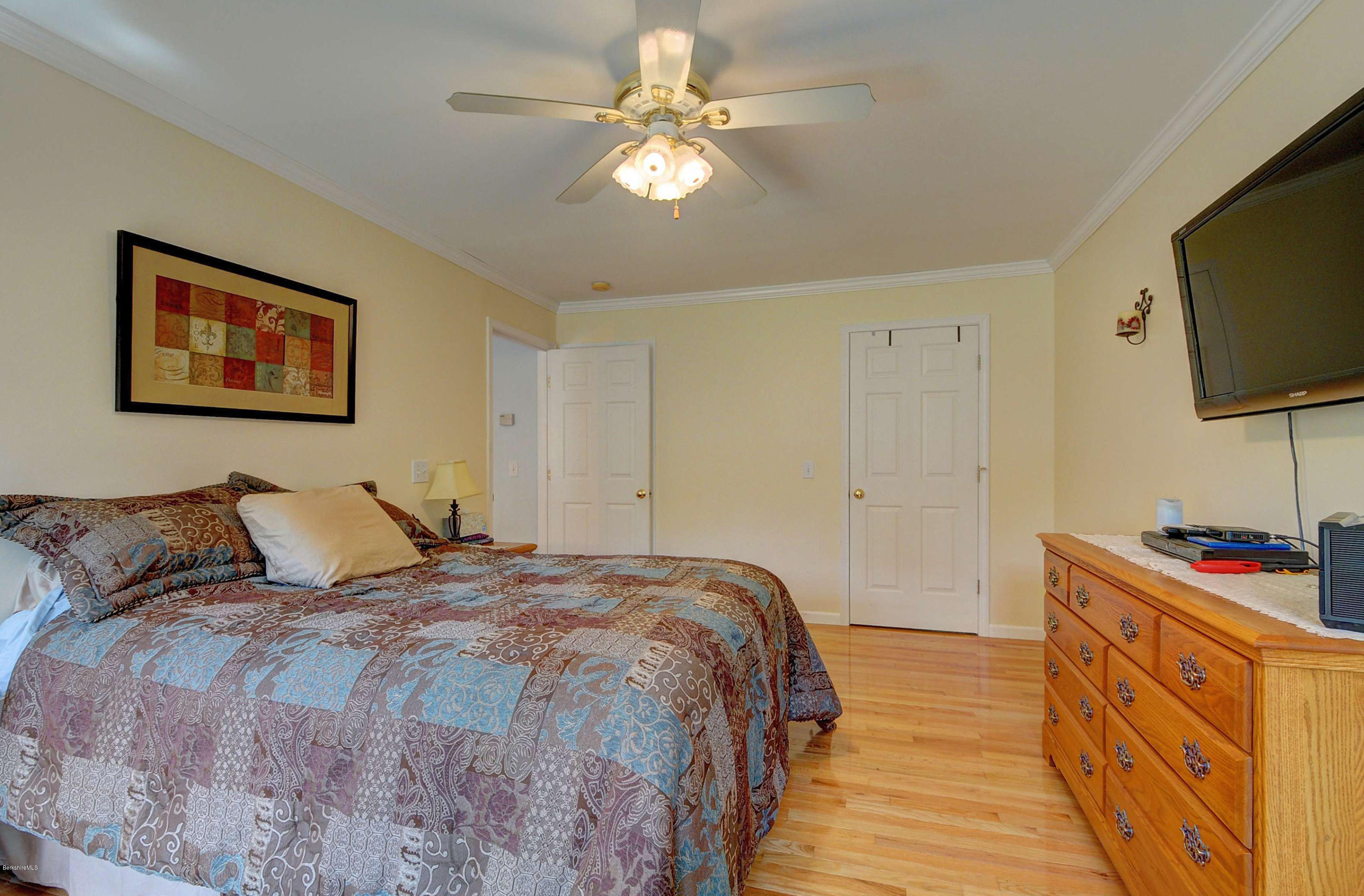 265 Smith Road Hinsdale, MA 01235 - Photo 24 of 27 a bedroom with a bed and a flat screen tv