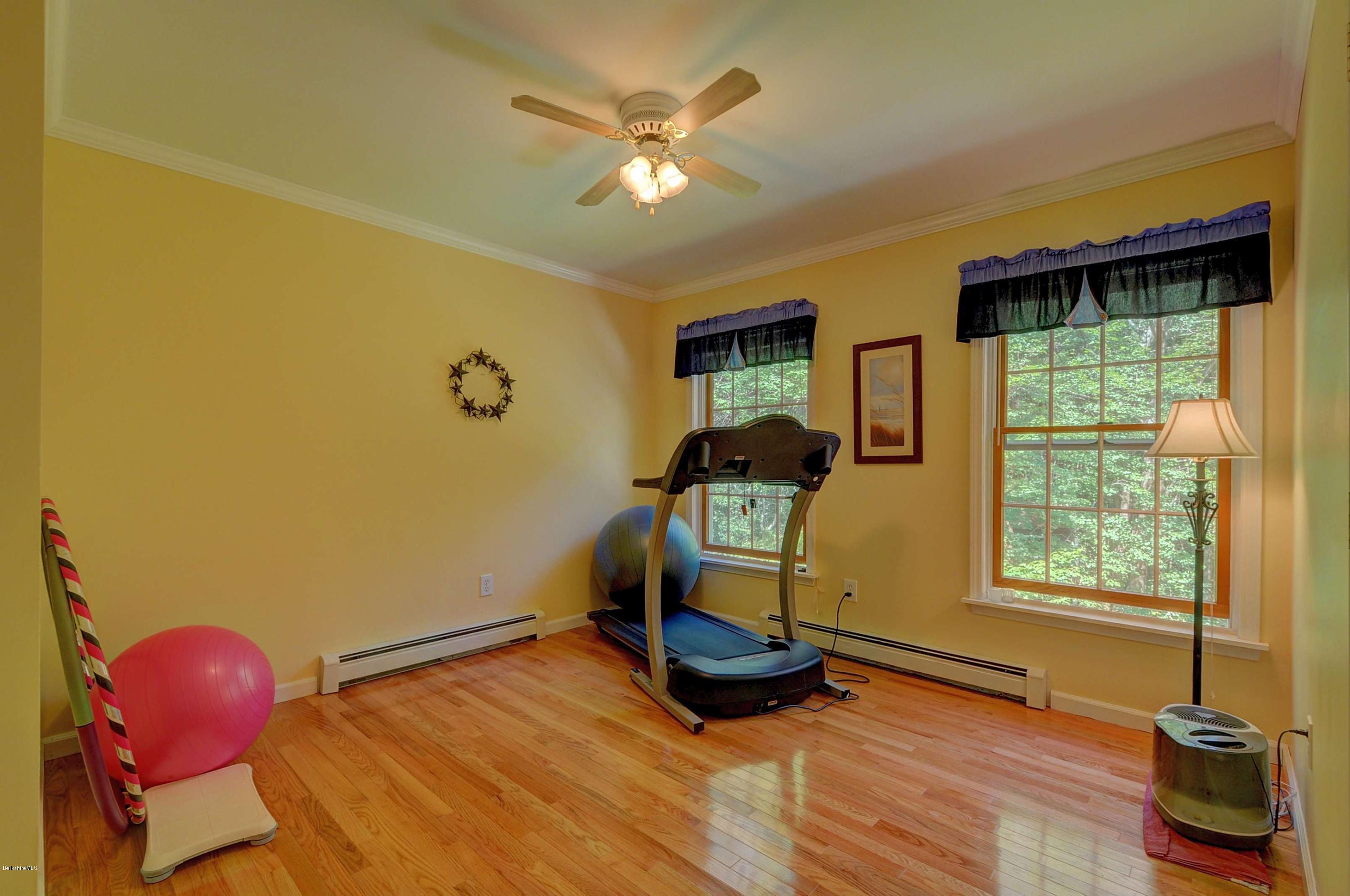 265 Smith Road Hinsdale, MA 01235 - Photo 26 of 27 a room with gym equipment and a window