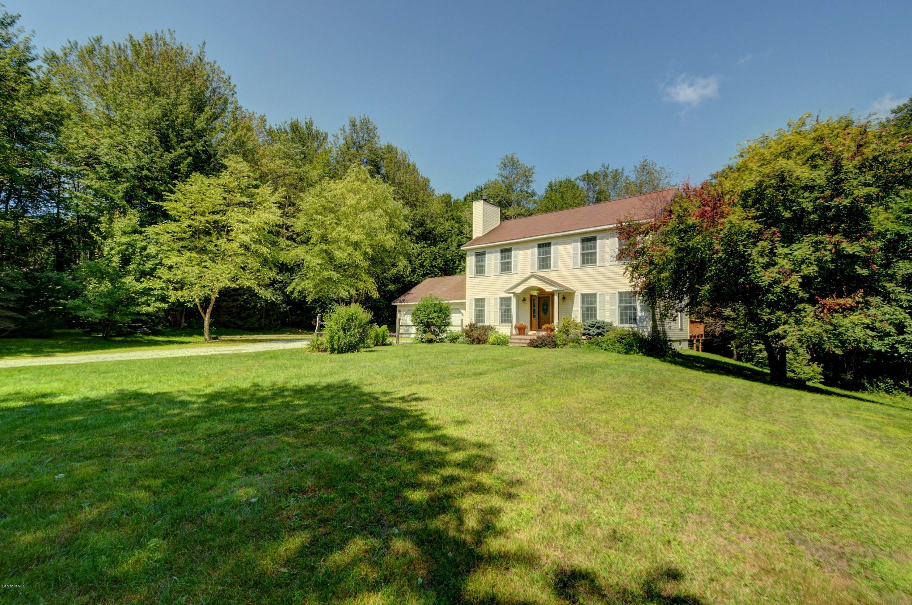 265 Smith Road Hinsdale, MA 01235 - Photo 4 of 27 a front view of a house with yard and green space