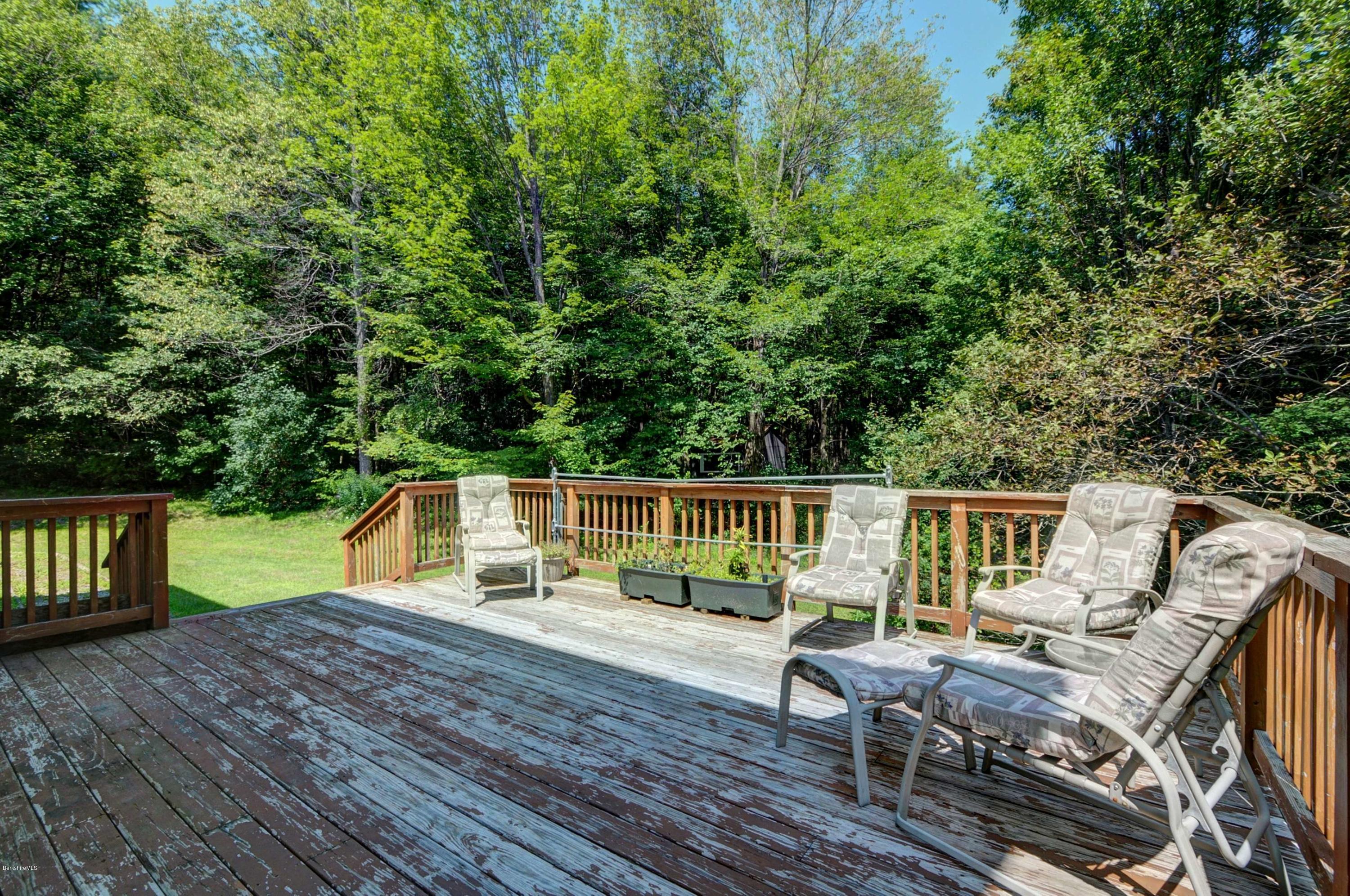 265 Smith Road Hinsdale, MA 01235 - Photo 5 of 27 a view of house with a deck and living space