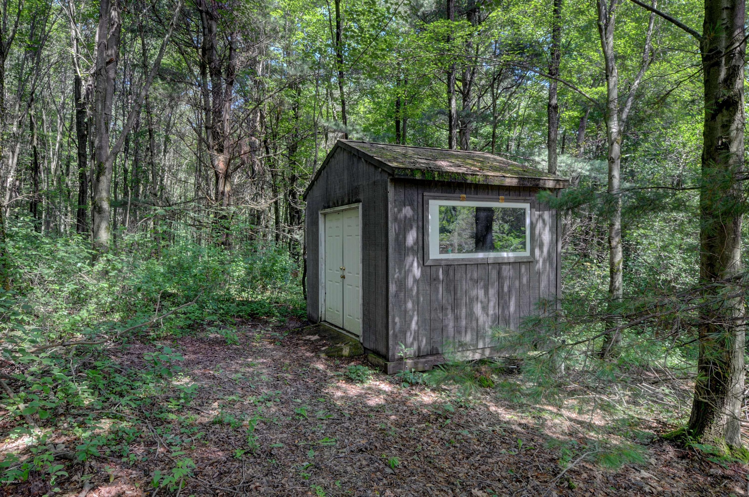 265 Smith Road Hinsdale, MA 01235 - Photo 8 of 27 a backyard of a house with lots of green space