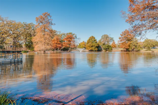 a view of a lake with houses in the back
