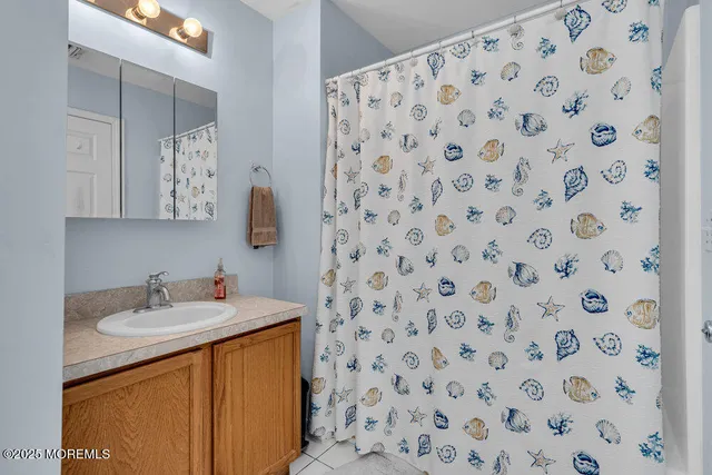 a bathroom with a sink toilet and mirror