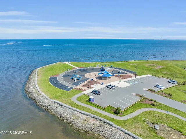 a view of a swimming pool with a yard