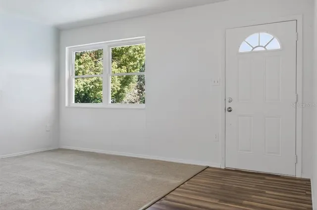 an empty room with windows