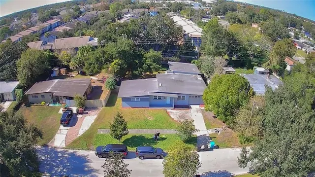 an aerial view of residential houses with outdoor space