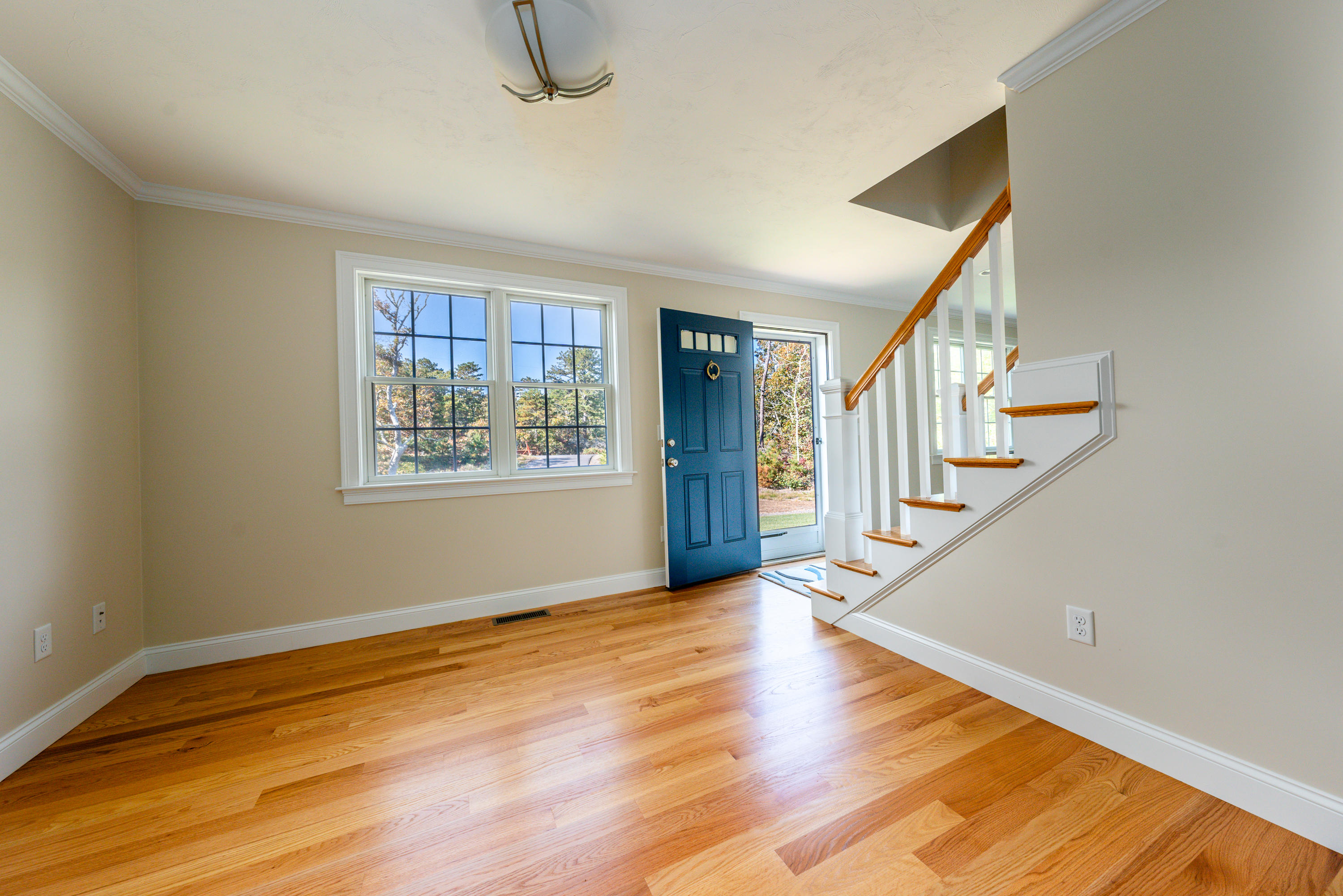 297 Depot Road Harwich, MA 02645 - Photo 13 of 22 a view of an empty room with wooden floor and a window