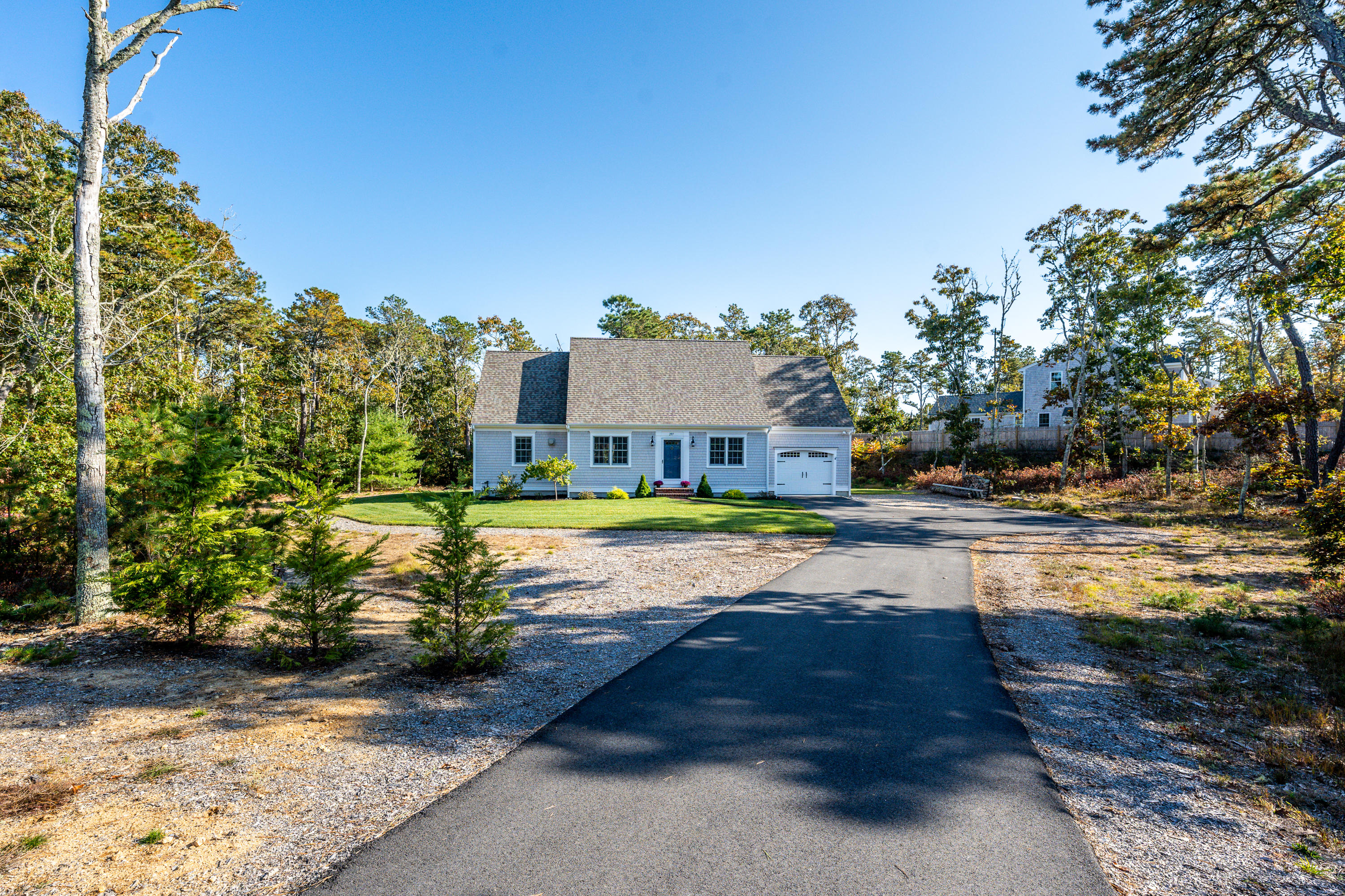 297 Depot Road Harwich, MA 02645 - Photo 17 of 22 a view of a house with swimming pool yard and sitting area