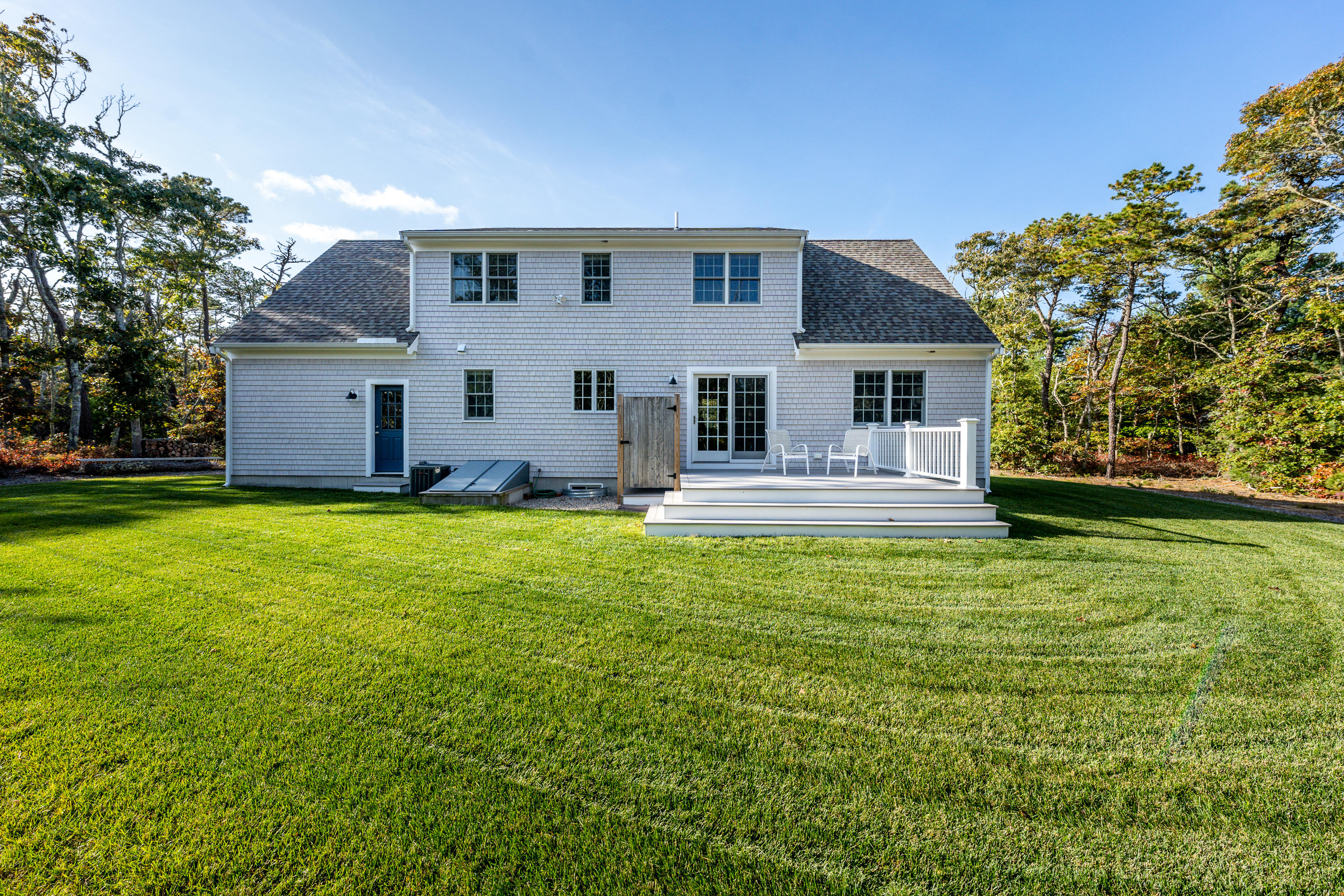297 Depot Road Harwich, MA 02645 - Photo 18 of 22 a front view of house with yard and green space