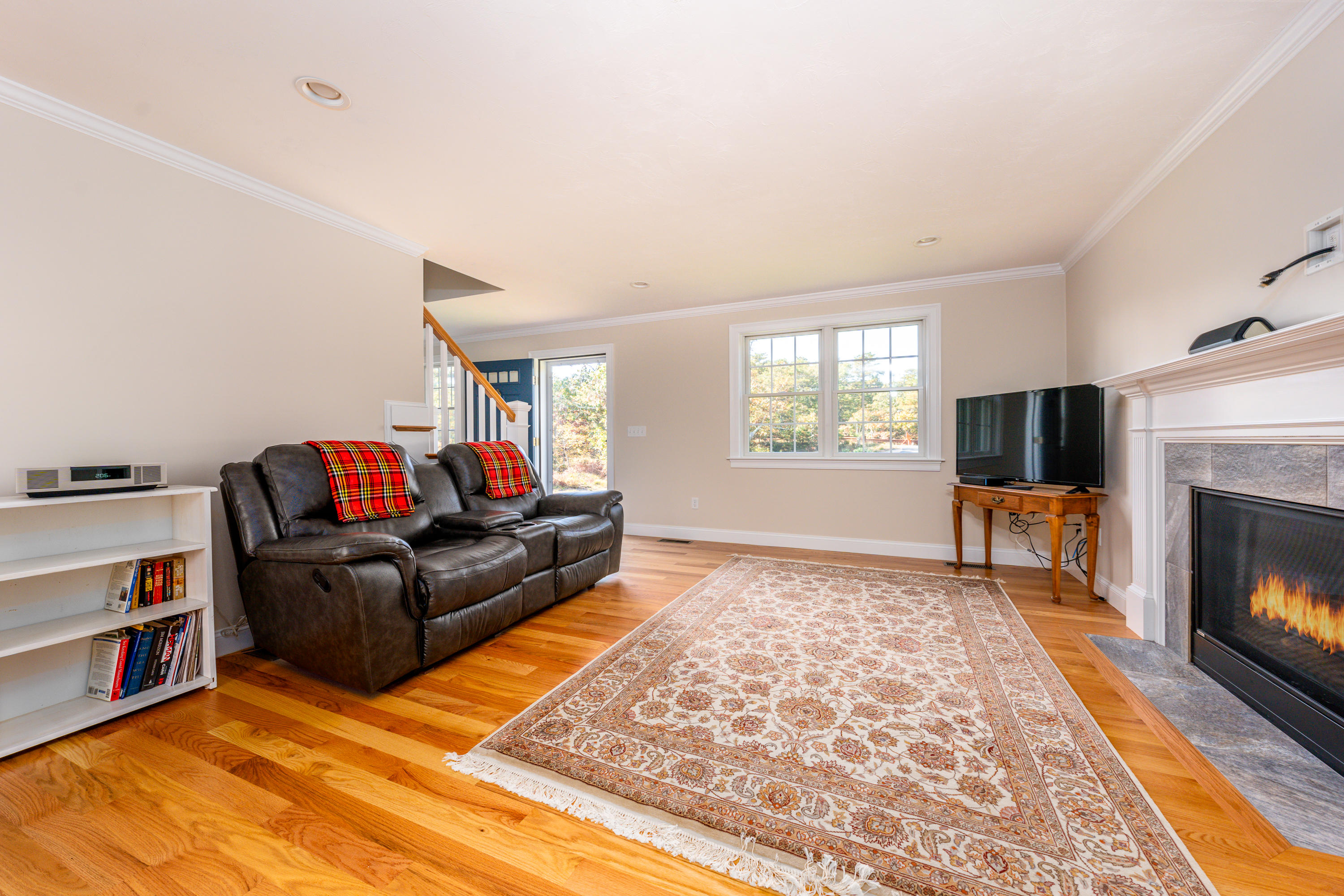 297 Depot Road Harwich, MA 02645 - Photo 3 of 22 a living room with furniture and a fireplace