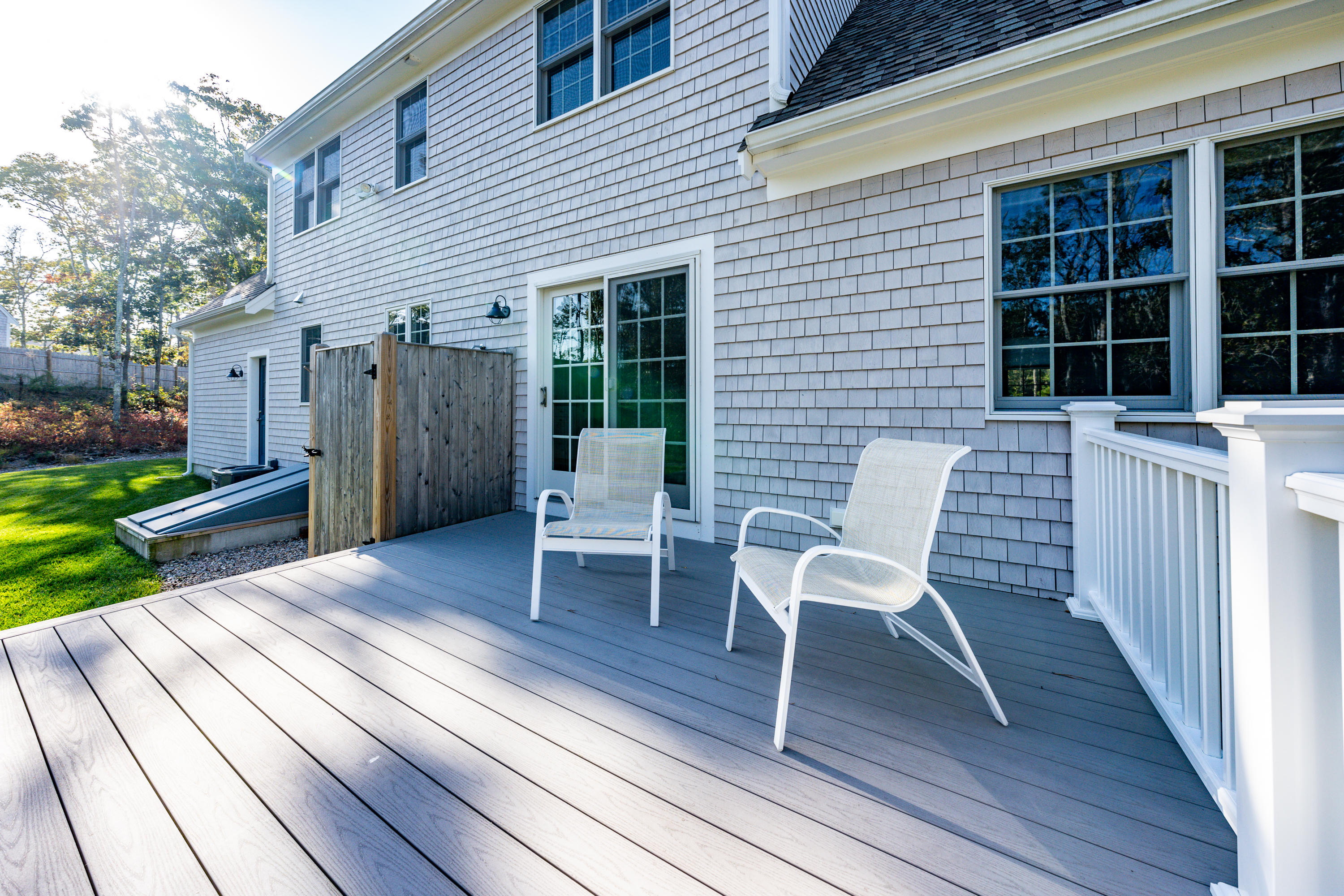 297 Depot Road Harwich, MA 02645 - Photo 9 of 22 a view of a wooden chairs on the deck