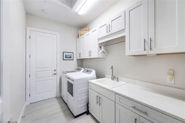 a utility room with cabinets