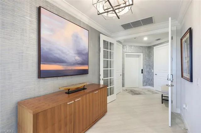 a view of a hallway with paintings on the wall