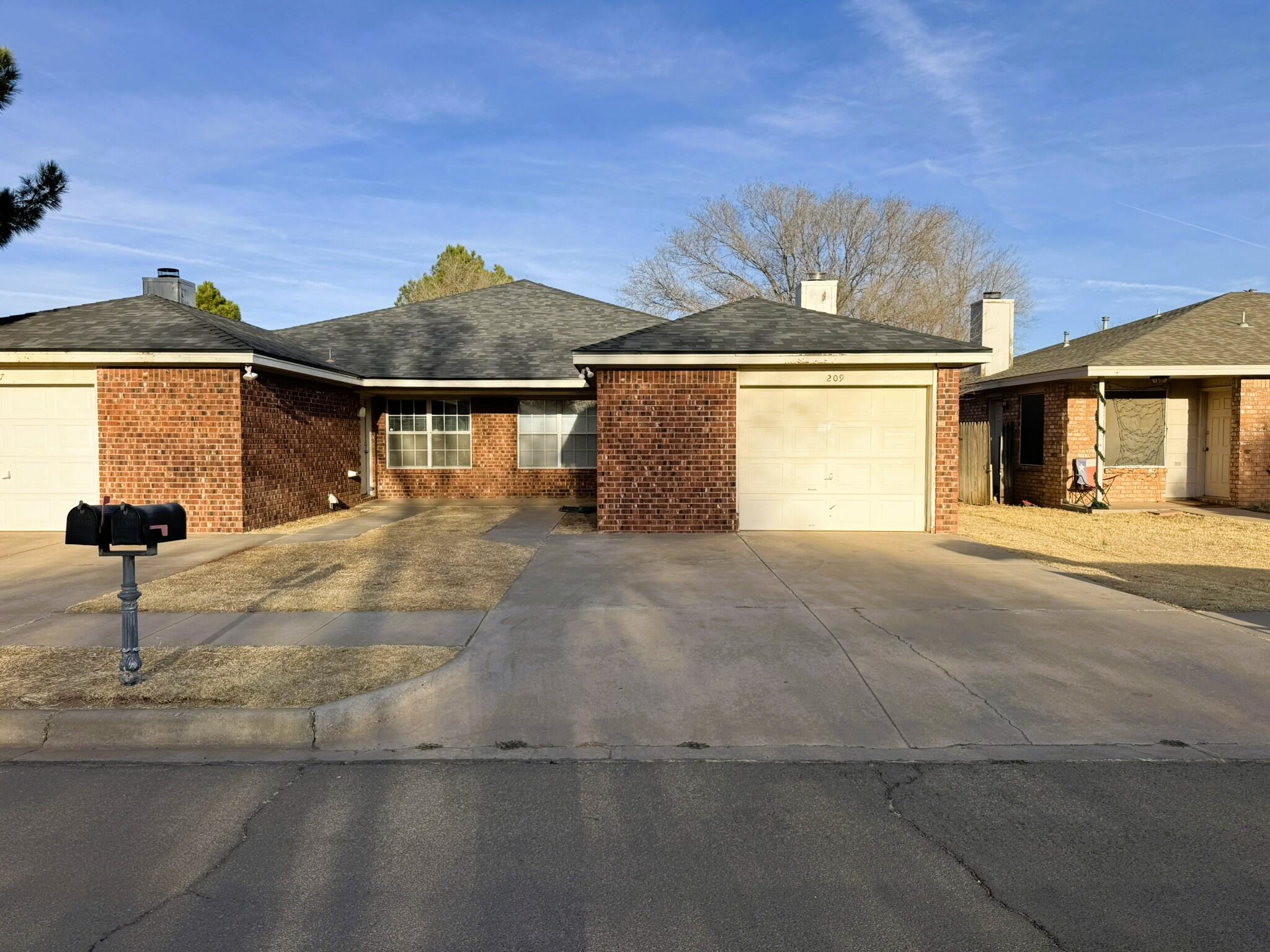 209 Grover Avenue Lubbock, TX 79416 - Photo 1 of 19 a view of swimming pool with a yard in front of it