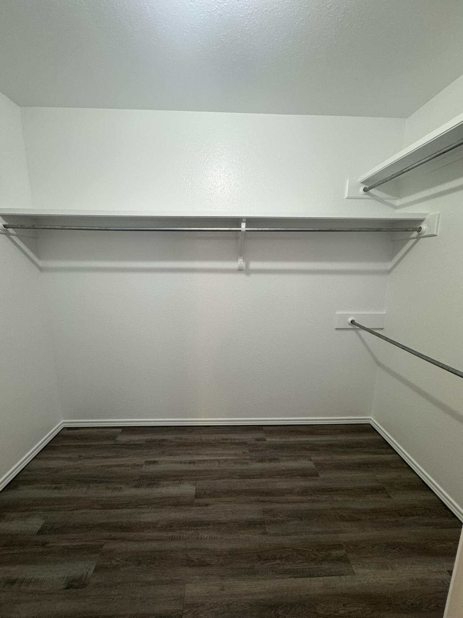 209 Grover Avenue Lubbock, TX 79416 - Photo 11 of 19 a view of an empty room with wooden floor