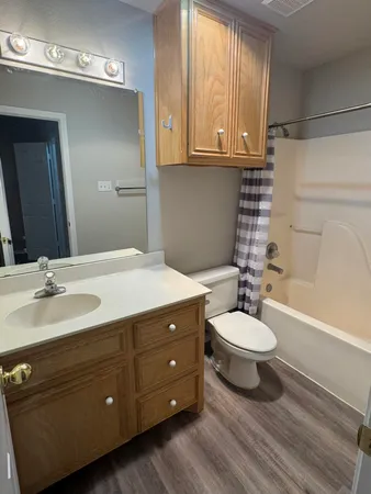 a bathroom with a toilet a sink and bathtub