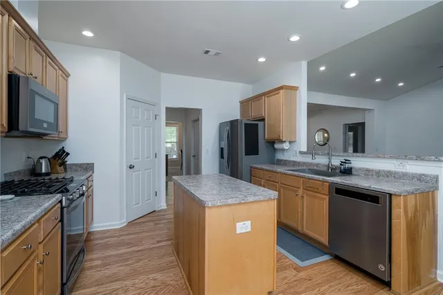 a dining room with furniture a fireplace and a chandelier