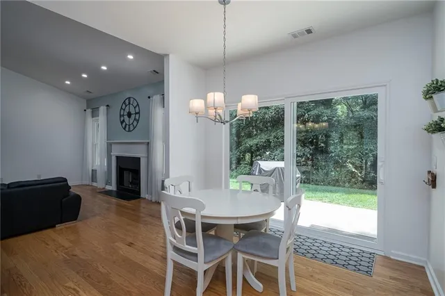 a kitchen with stainless steel appliances granite countertop a stove top oven a sink dishwasher and a refrigerator