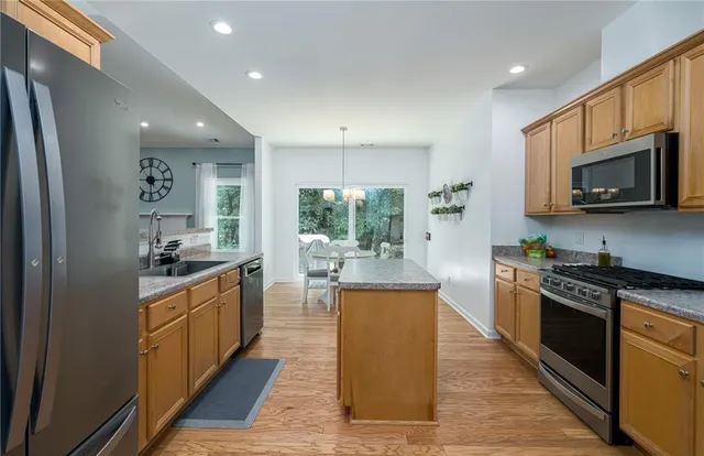 a living room with a bed and a flat screen tv