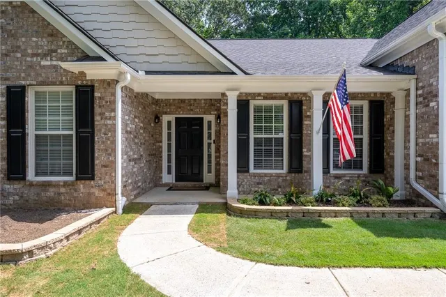 a view of a house that has a small garden