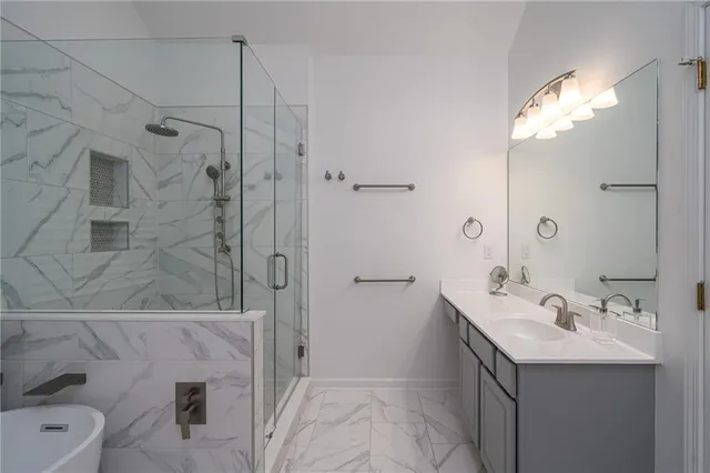 a bathroom with a sink vanity and mirror