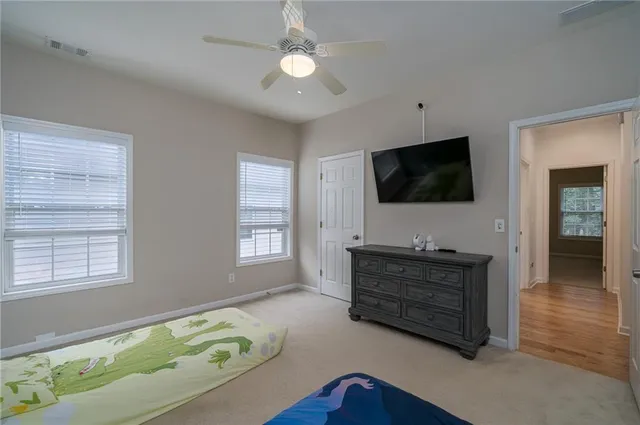 a bathroom with a sink vanity granite and toilet