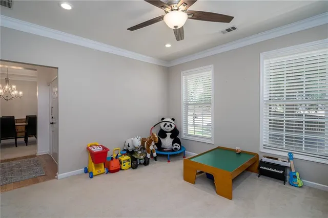 a view of a dining room with furniture and window