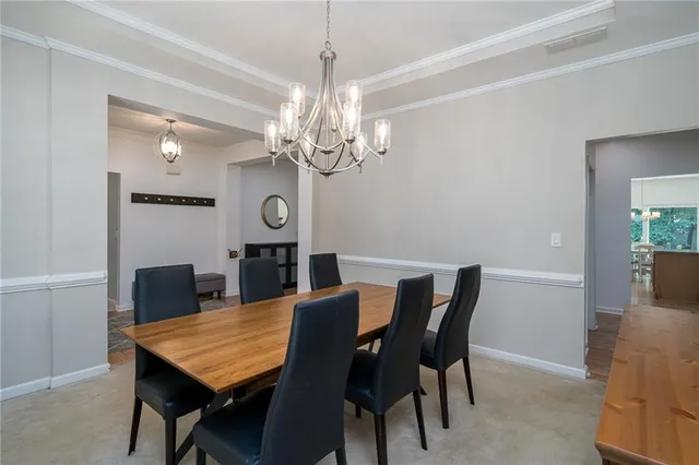 a view of a dining room with furniture and window