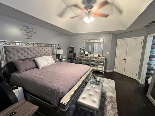 a bed room with a bed and a chandelier